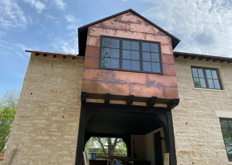 Copper metal panel facade on a stone building for Metal Roof Coating in Hondo